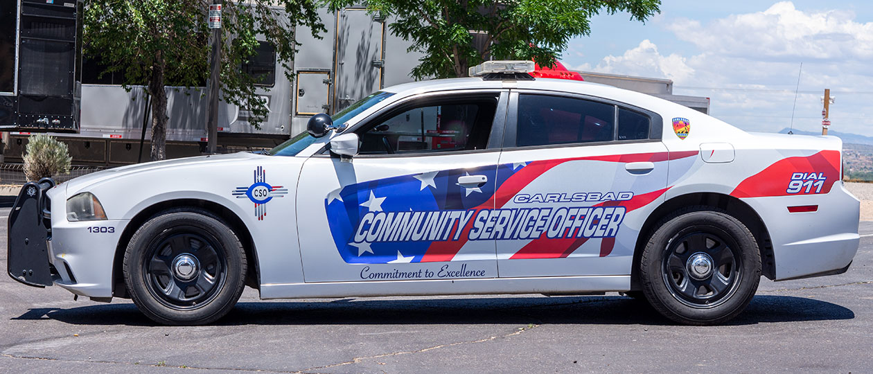 The Carlsbad Police Department wanted to spice up a patrol Charger for their Community Service Officer, so they added a flag wrap and custom Zia emblem to distinguish it from their patrol vehicles.